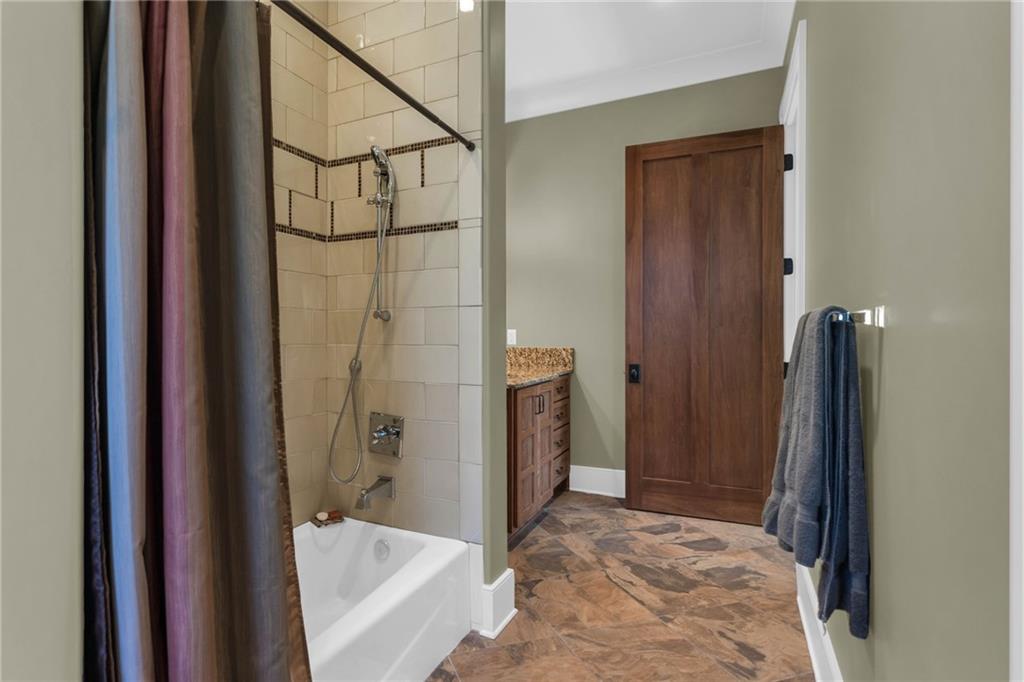 1086 Arbor Hill Road Canton, GA 30115 - Photo 55 of 98 a bathroom with a shower and a tub