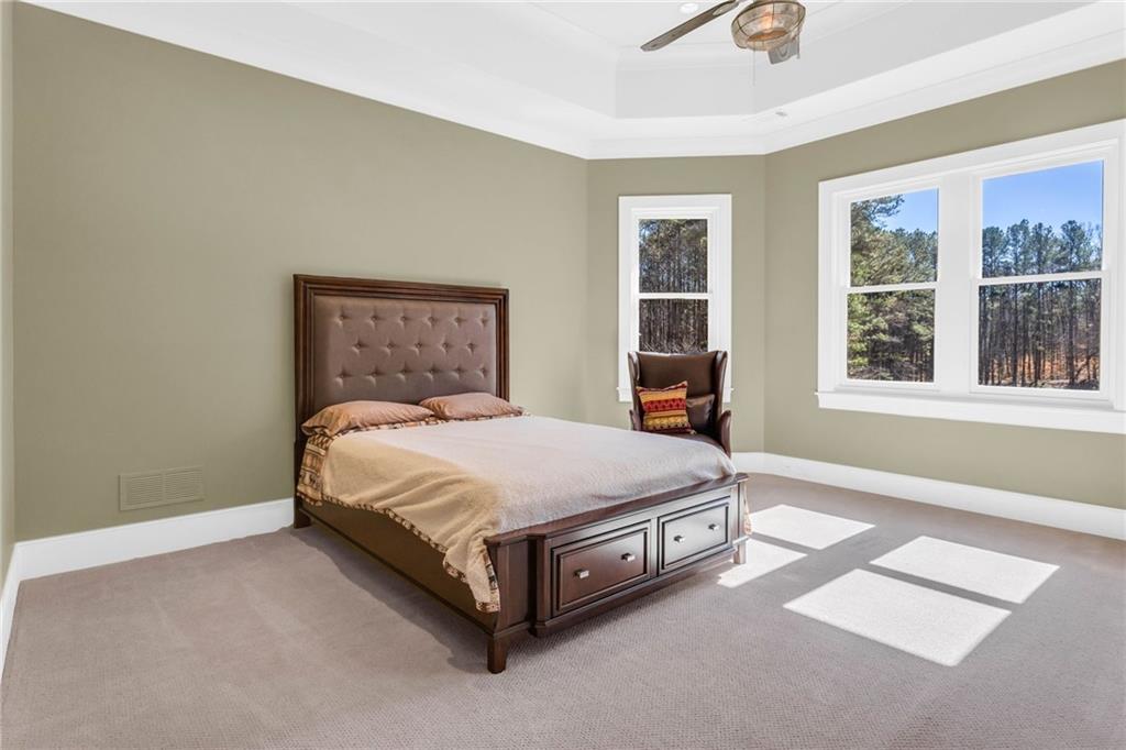 1086 Arbor Hill Road Canton, GA 30115 - Photo 56 of 98 a bedroom with a bed lamp and window