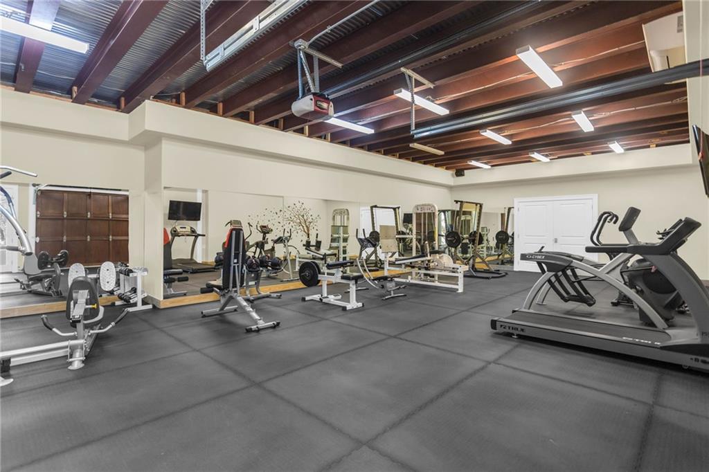 1086 Arbor Hill Road Canton, GA 30115 - Photo 67 of 98 a view of a room with gym equipment