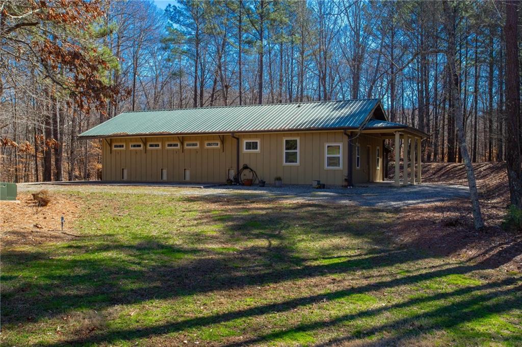 1086 Arbor Hill Road Canton, GA 30115 - Photo 79 of 98 a view of swimming pool with an outdoor seating and a yard
