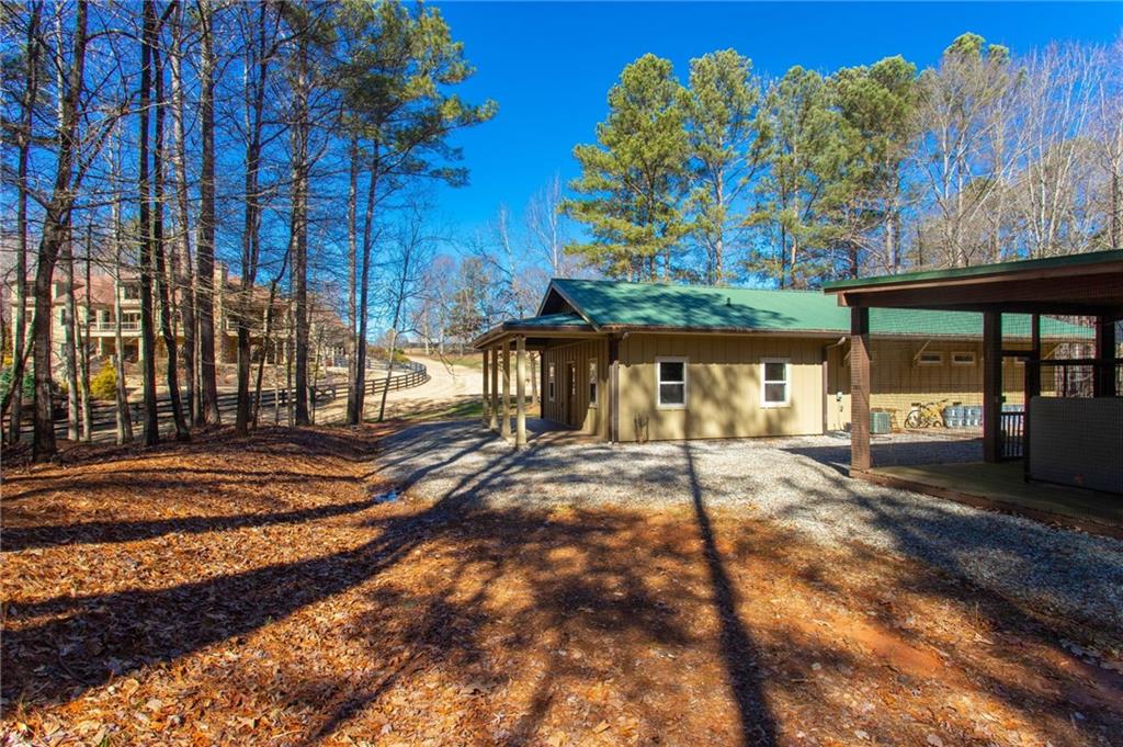 1086 Arbor Hill Road Canton, GA 30115 - Photo 84 of 98 a view of a house with a yard and tree s