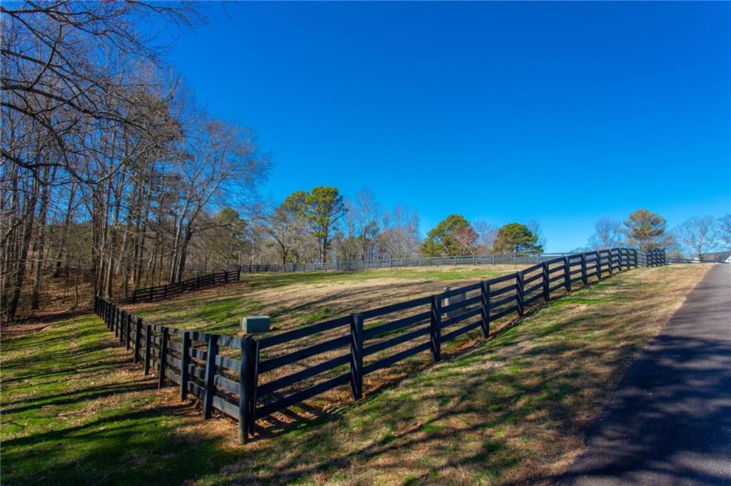 1086 Arbor Hill Road Canton, GA 30115 - Photo 87 of 98 a view of a bench in a backyard