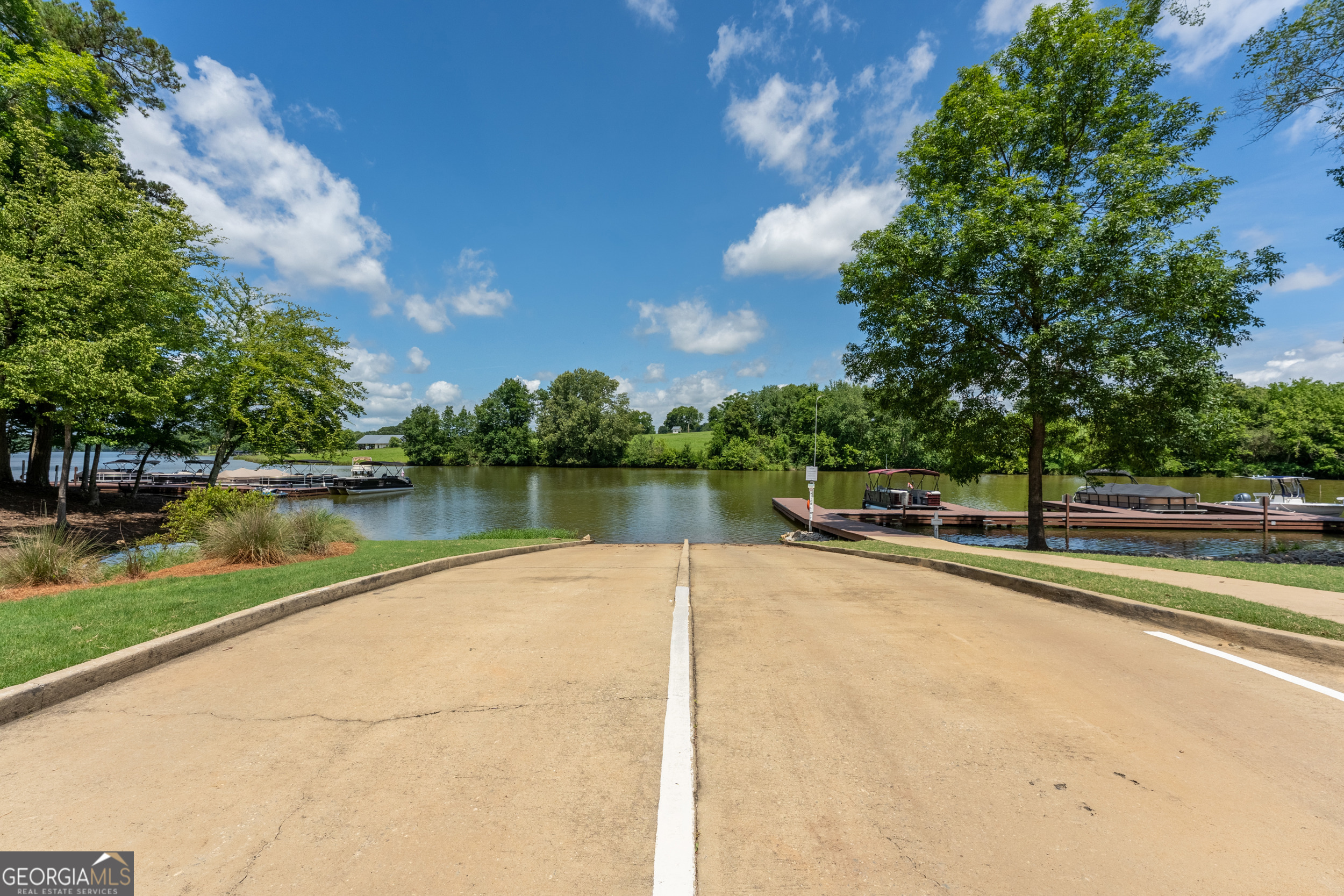 1071 Southern Pne Road Greensboro, GA 30642 - Photo 33 of 35 a view of a lake with a house in the background