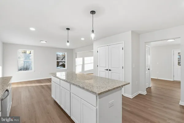 a view of kitchen island with wooden floor