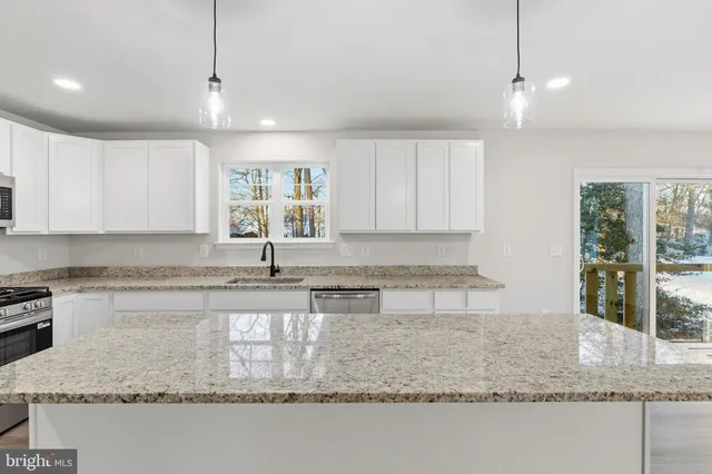 a bathroom with a sink and a large mirror