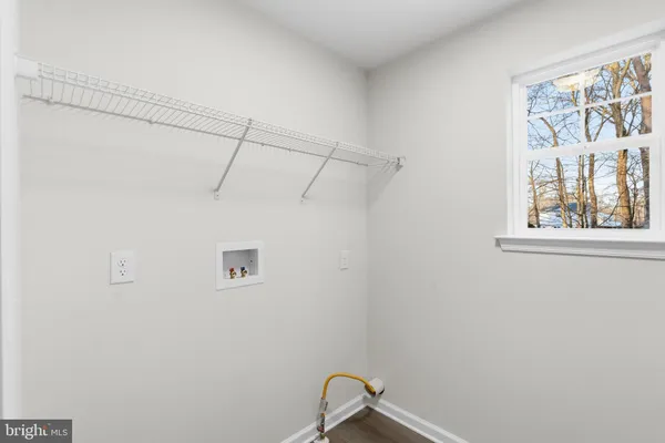 a view of a small space with racks on the wall