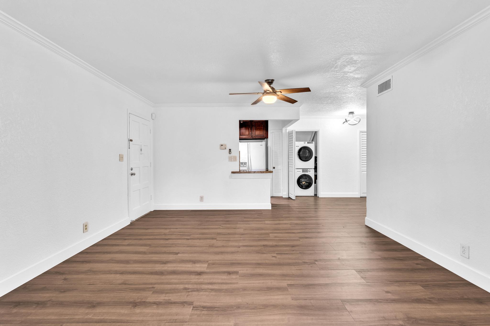 1291 Northwest 13th Street, Unit 445D Boca Raton, FL 33486 - Photo 18 of 50 a view of an empty room with wooden floor