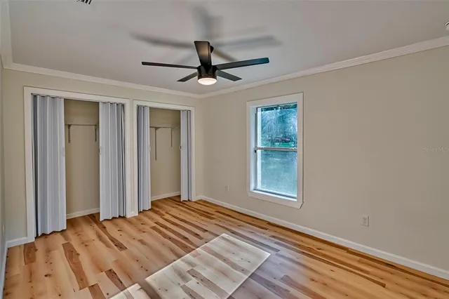a bedroom with bed and window