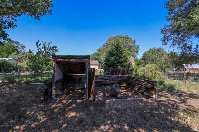270 East 100 North Monroe, UT 84754 - Photo 59 of 65 Rustic outdoor structure with a sloped roof and log-style sides