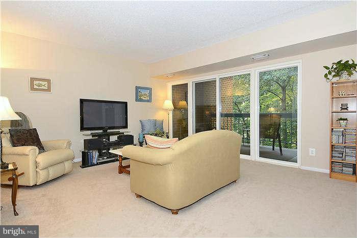 11835 Shire Court, Unit 21B Reston, VA 20191 - Photo 4 of 14 generous living room with scenic view