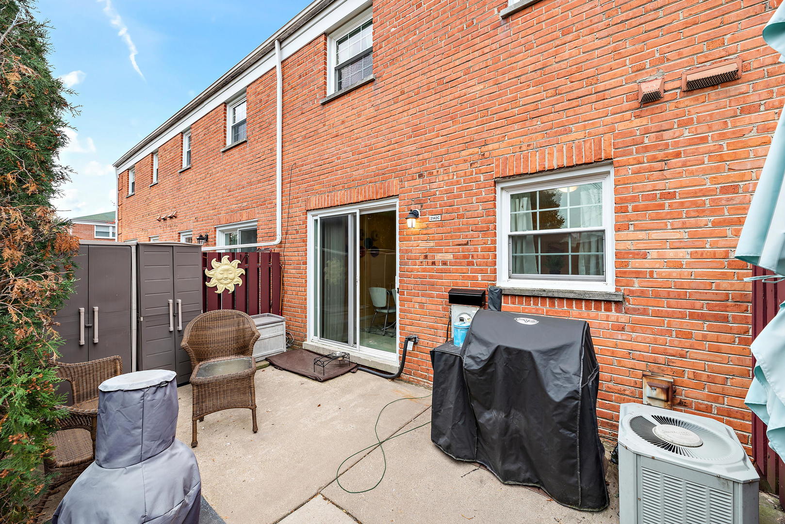 2142 Rugen Road, Unit C Glenview, IL 60026 - Photo 21 of 24 a building outdoor space with patio furniture and potted plants