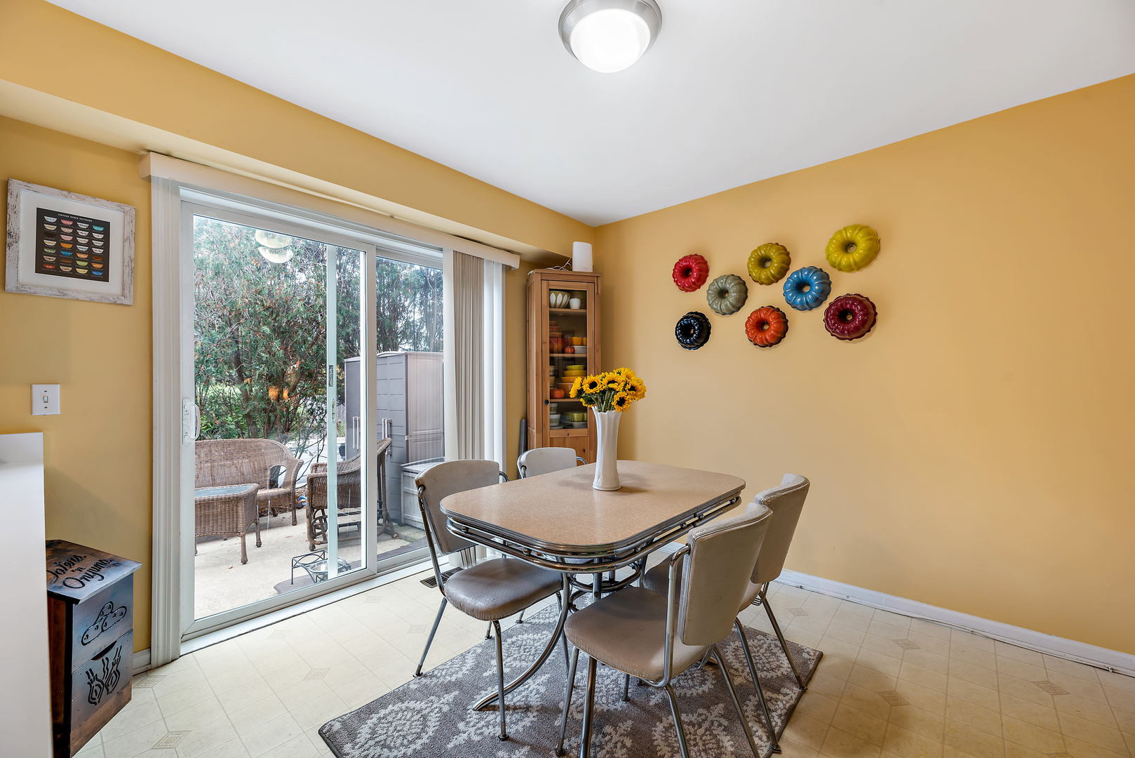 2142 Rugen Road, Unit C Glenview, IL 60026 - Photo 8 of 24 a view of a dining room with furniture and wooden floor