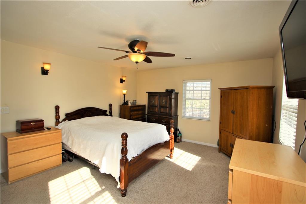 57 Cracker Jack Road Monongahela, PA 15063 - Photo 13 of 25 a bedroom with a bed and a flat tv screen on dresser