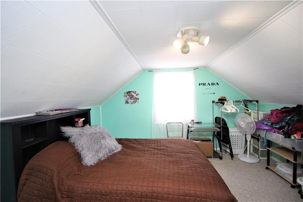 57 Cracker Jack Road Monongahela, PA 15063 - Photo 18 of 25 a bedroom with a bed and a chandelier