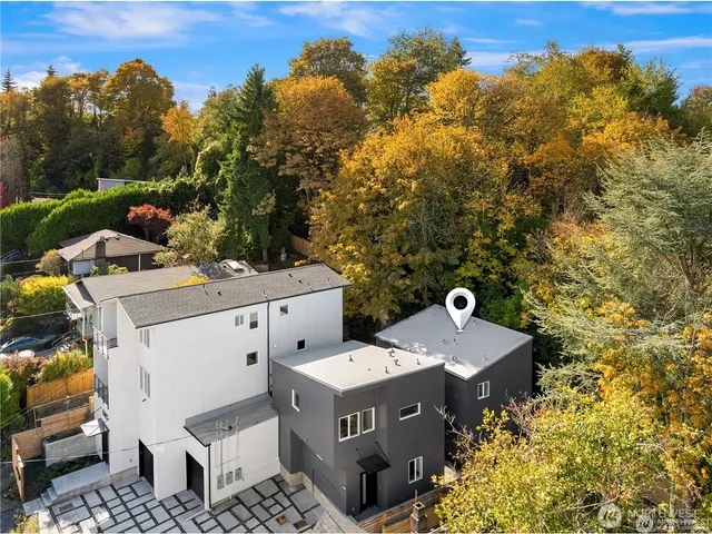 view of a house with yard and outdoor seating