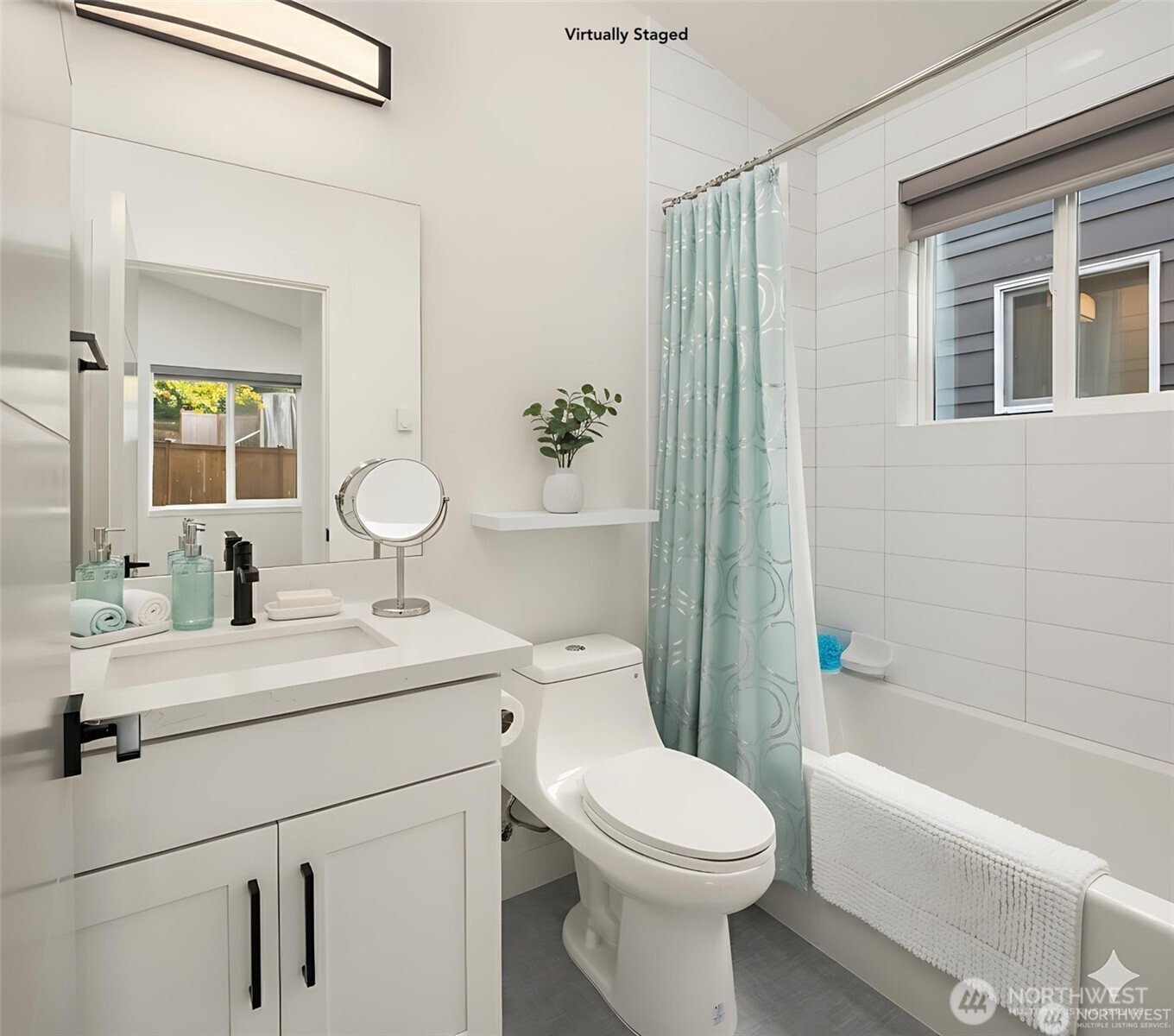 3817 Letitia Avenue South Seattle, WA 98118 - Photo 11 of 16 a bathroom with a sink a toilet and shower