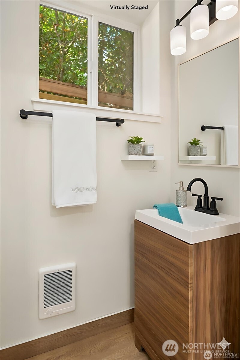 3817 Letitia Avenue South Seattle, WA 98118 - Photo 12 of 16 a close view of a sink a mirror and a window