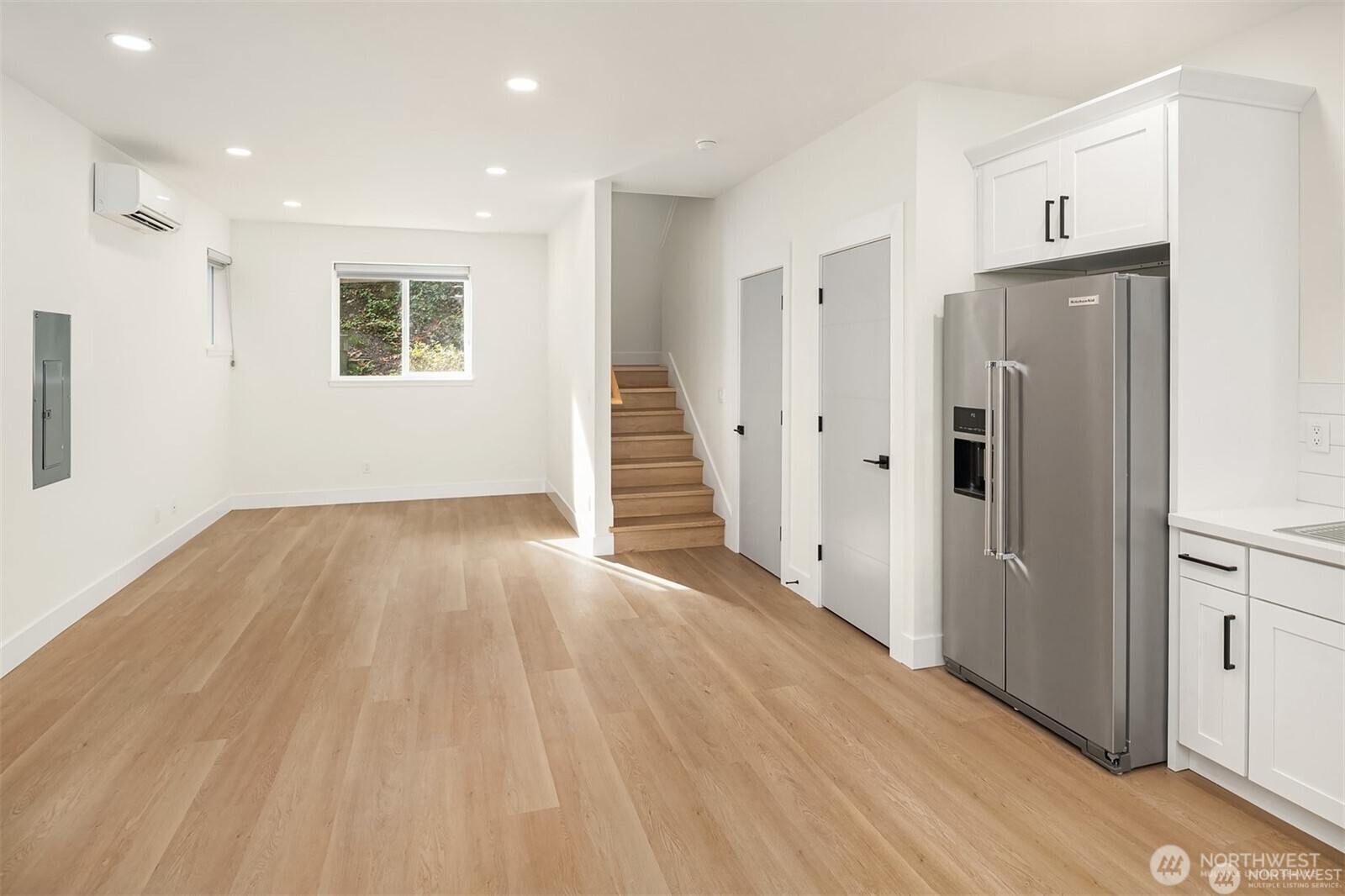 3817 Letitia Avenue South Seattle, WA 98118 - Photo 6 of 16 a view of a hallway with wooden floor and staircase