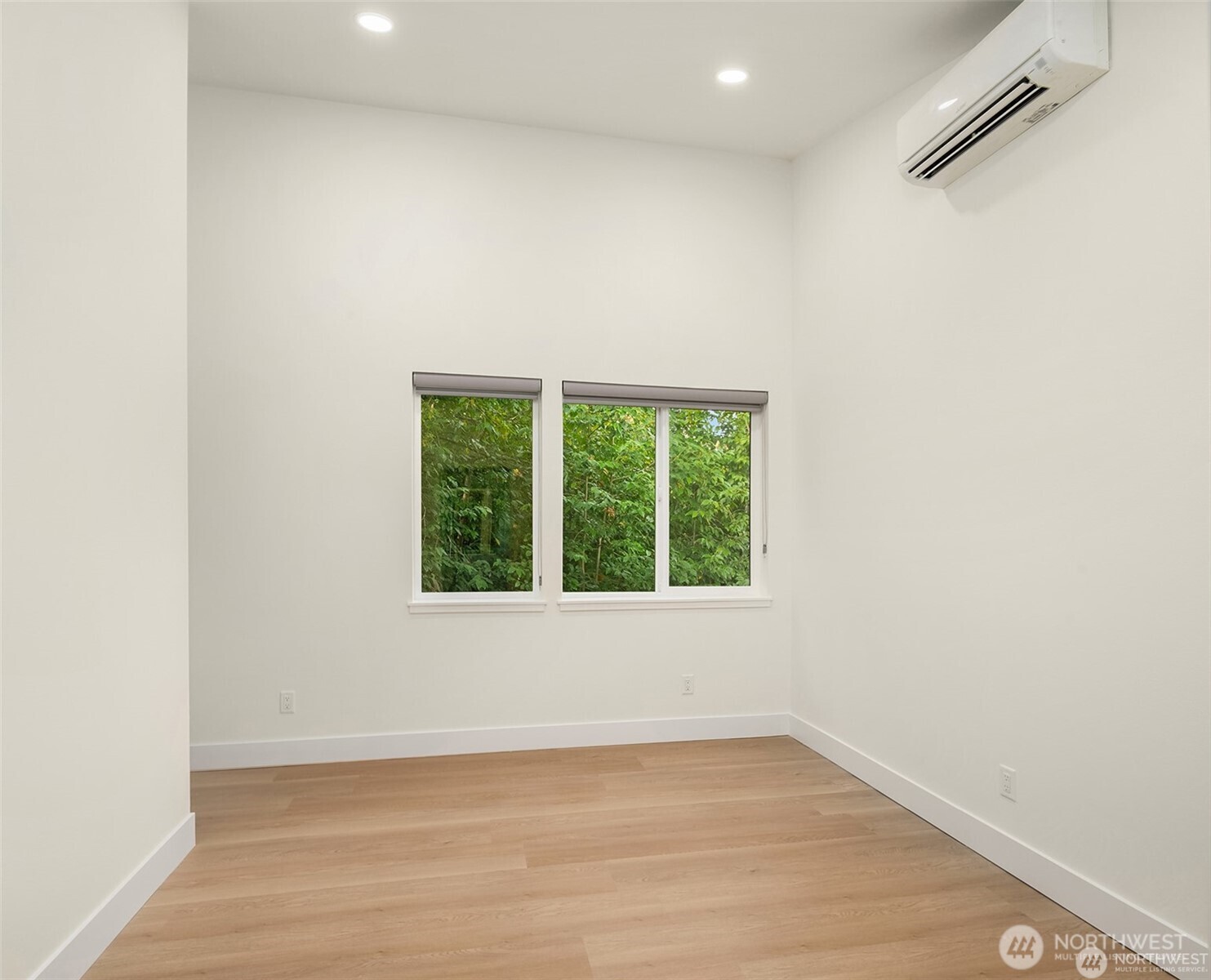 3817 Letitia Avenue South Seattle, WA 98118 - Photo 8 of 16 an empty room with wooden floor and windows