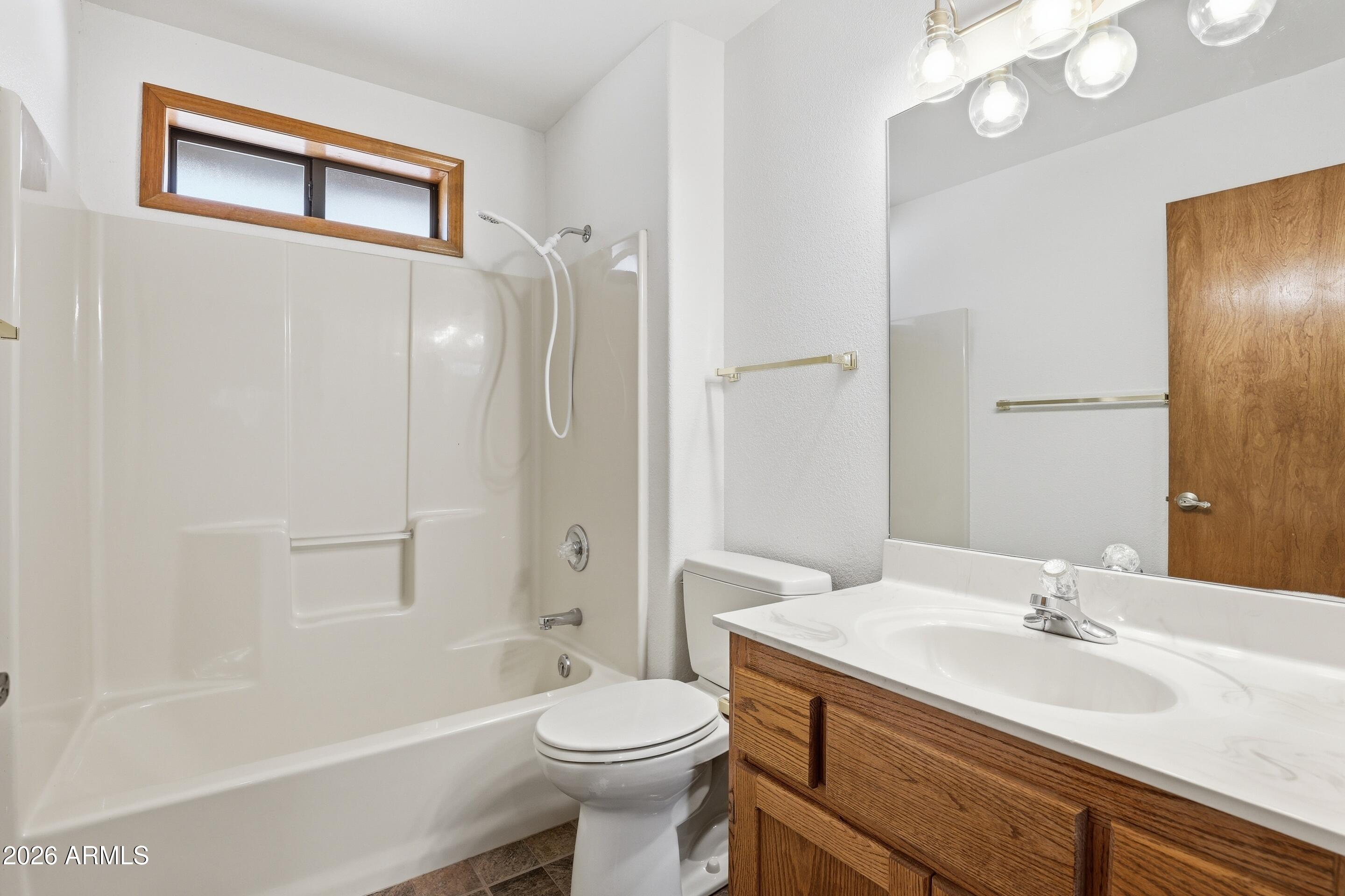 1405 East Graham Rnch Trail Payson, AZ 85541 - Photo 22 of 46 a bathroom with a sink a toilet and shower