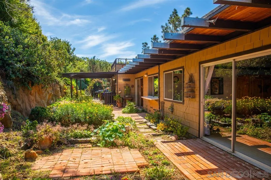 692 Rimini Road Del Mar, CA 92014 - Photo 15 of 25 a front view of a house with a yard