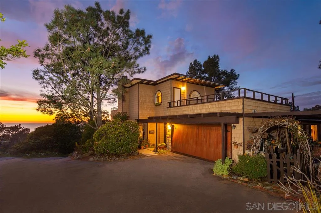 692 Rimini Road Del Mar, CA 92014 - Photo 18 of 25 a front view of a house with a yard