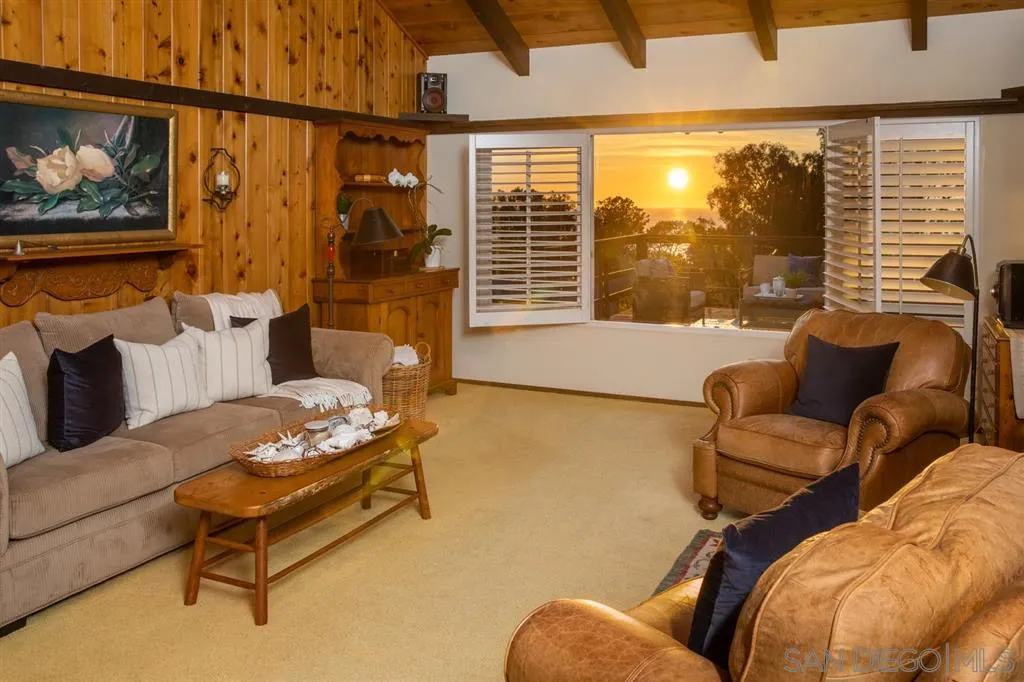 692 Rimini Road Del Mar, CA 92014 - Photo 19 of 25 a living room with furniture and a large window