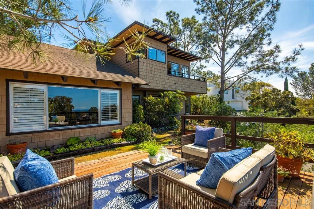 692 Rimini Road Del Mar, CA 92014 - Photo 2 of 25 a view of a patio with couches chairs and a potted plant