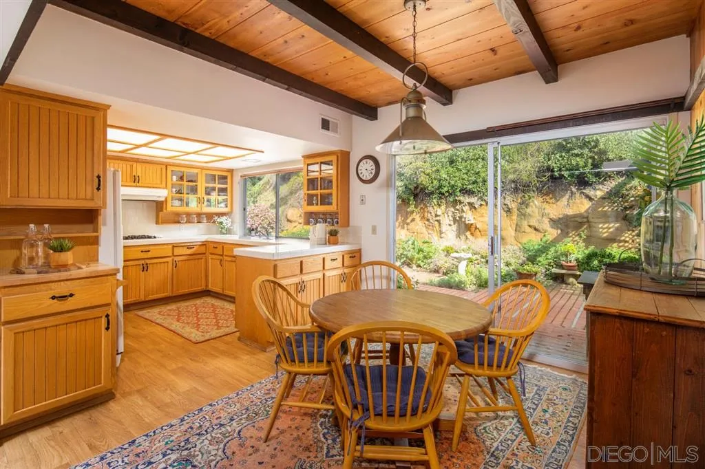 692 Rimini Road Del Mar, CA 92014 - Photo 8 of 25 a view of a dining room with furniture window and outside view