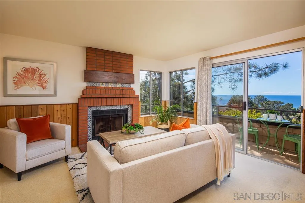 692 Rimini Road Del Mar, CA 92014 - Photo 9 of 25 a living room with furniture and a fireplace