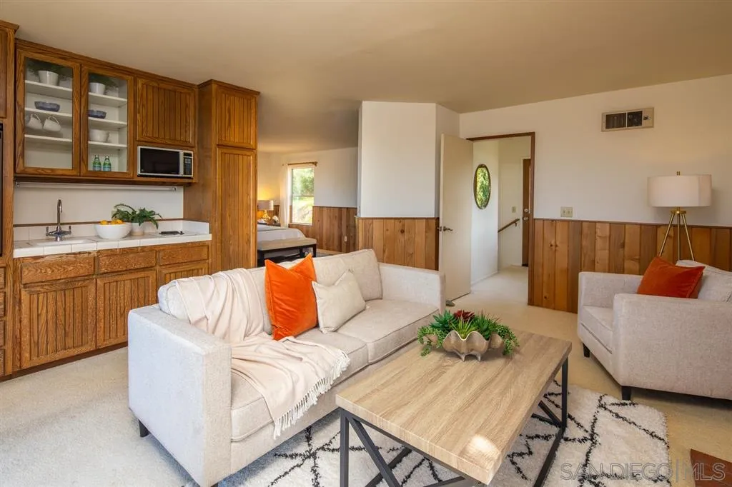 692 Rimini Road Del Mar, CA 92014 - Photo 10 of 25 a living room with furniture and wooden floor