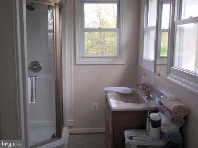 7917 Shore Road Sparrows Point, MD 21219 - Photo 12 of 16 a bathroom with a sink and a window