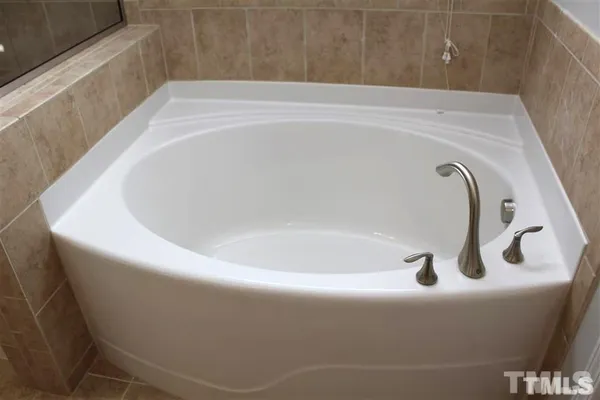 a bath tub sitting in a bathroom