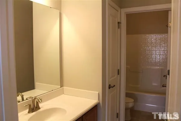 a bathroom with a sink and shower