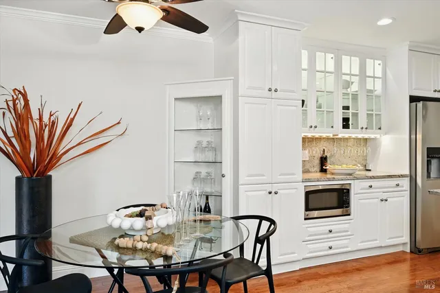 a view of kitchen with cabinets and wooden floor