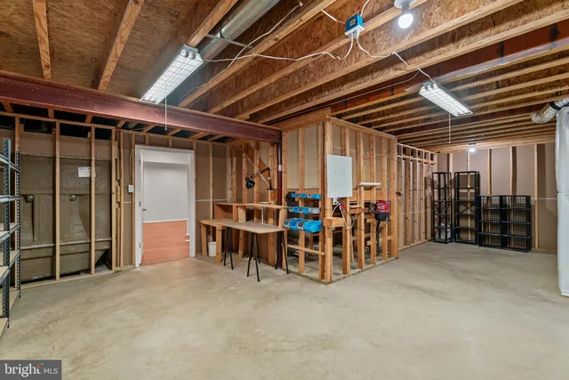 a view of a house with brick walls and potted plants