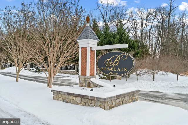 a black and white photo of a white house