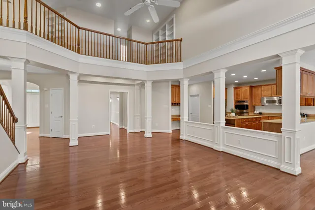 a view of an entryway with wooden floor and windows