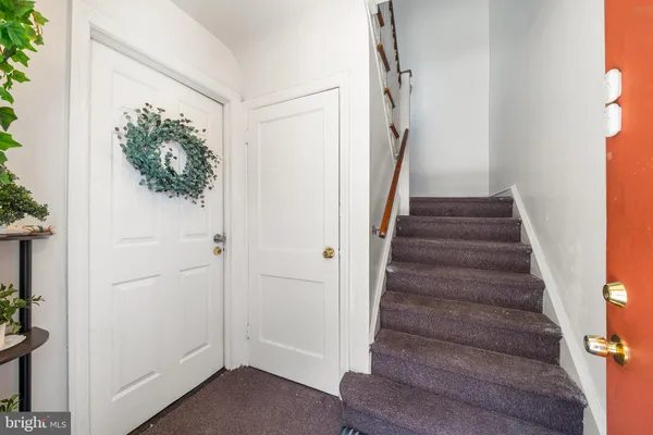 a view of entryway with wooden floor