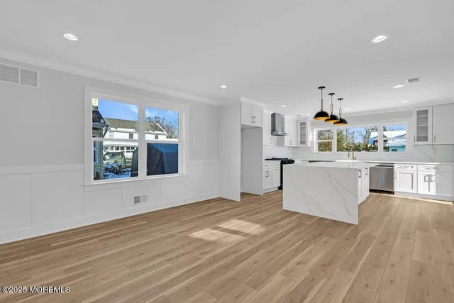 a view of a kitchen with microwave and cabinets