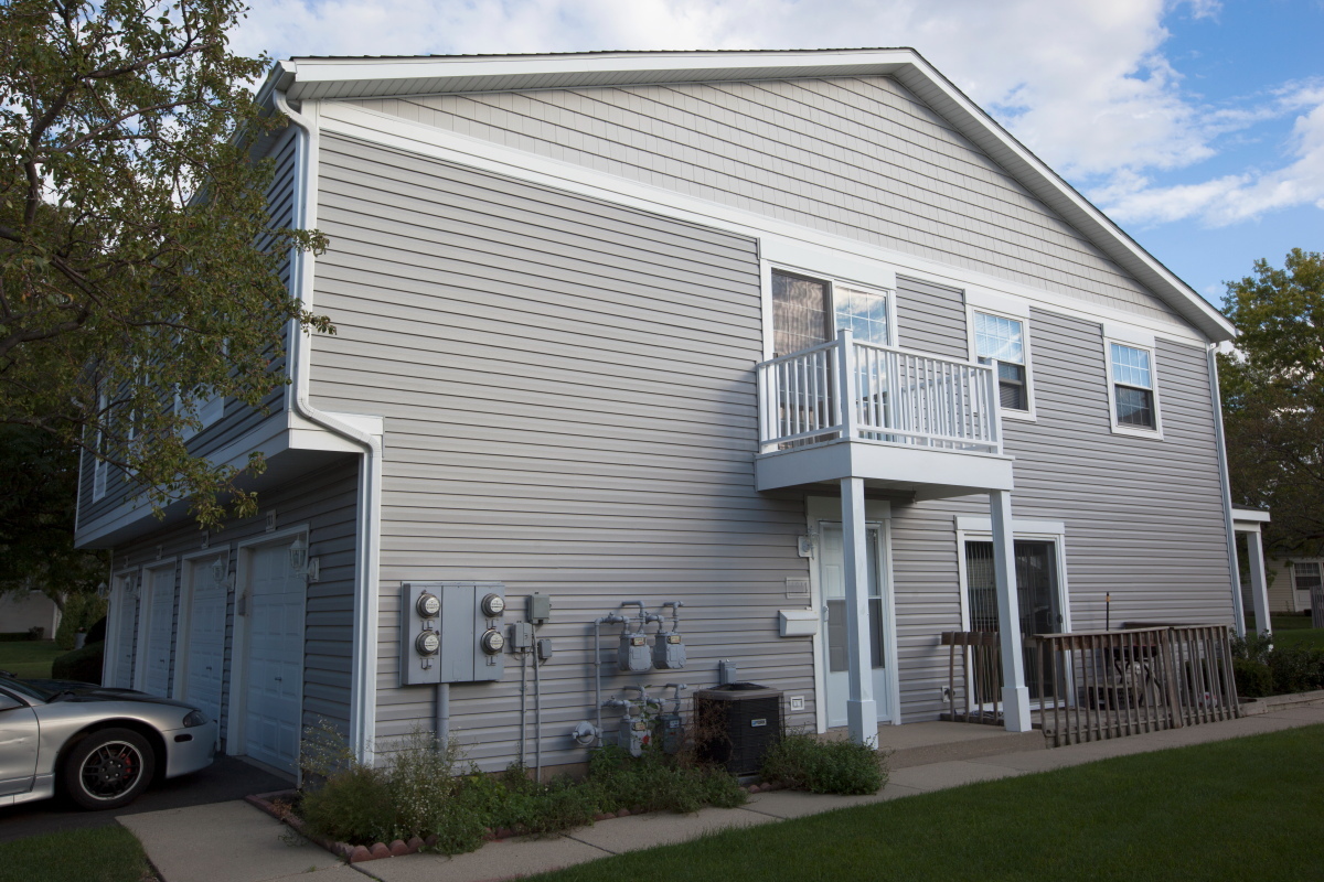 a view of a house with a yard and garage