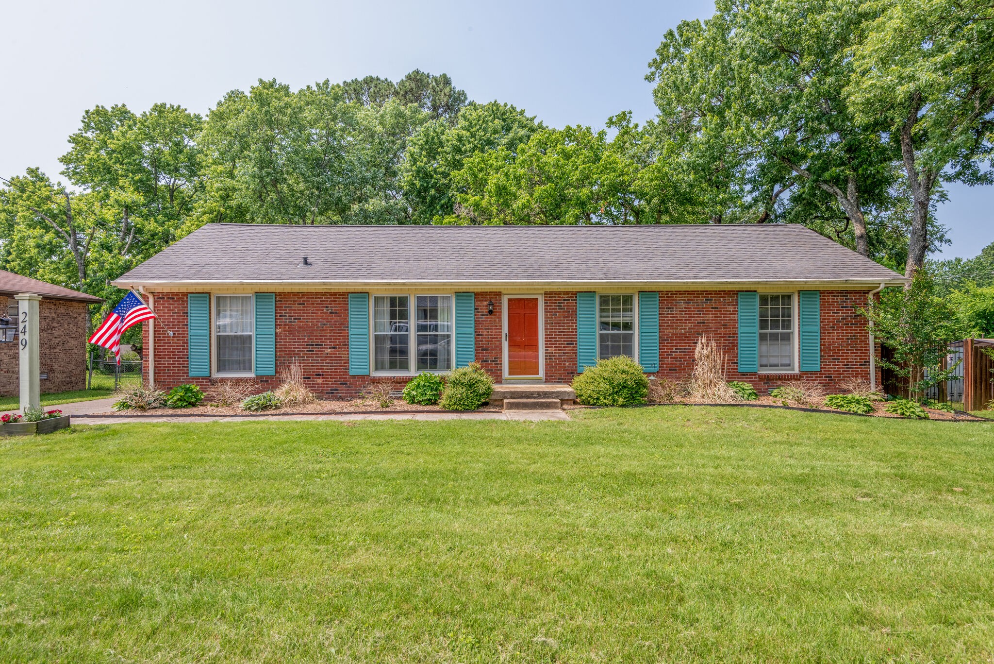 front view of a house with a garden