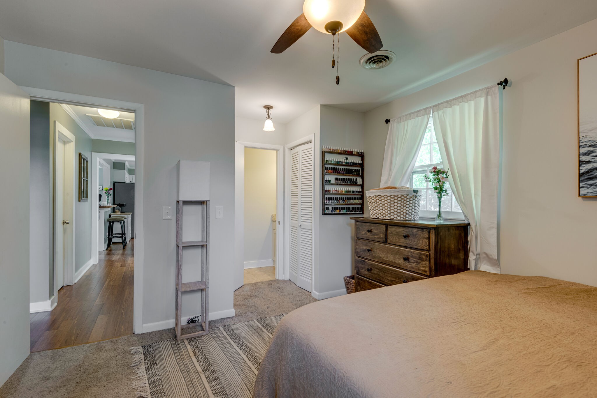 249 Bart Drive Antioch, TN 37013 - Photo 13 of 28 a bedroom with a bed and a chandelier