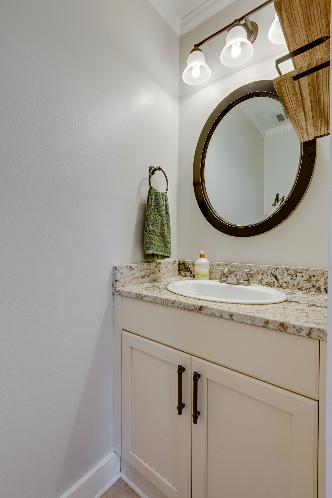 249 Bart Drive Antioch, TN 37013 - Photo 14 of 28 a bathroom with a granite countertop toilet sink mirror and vanity