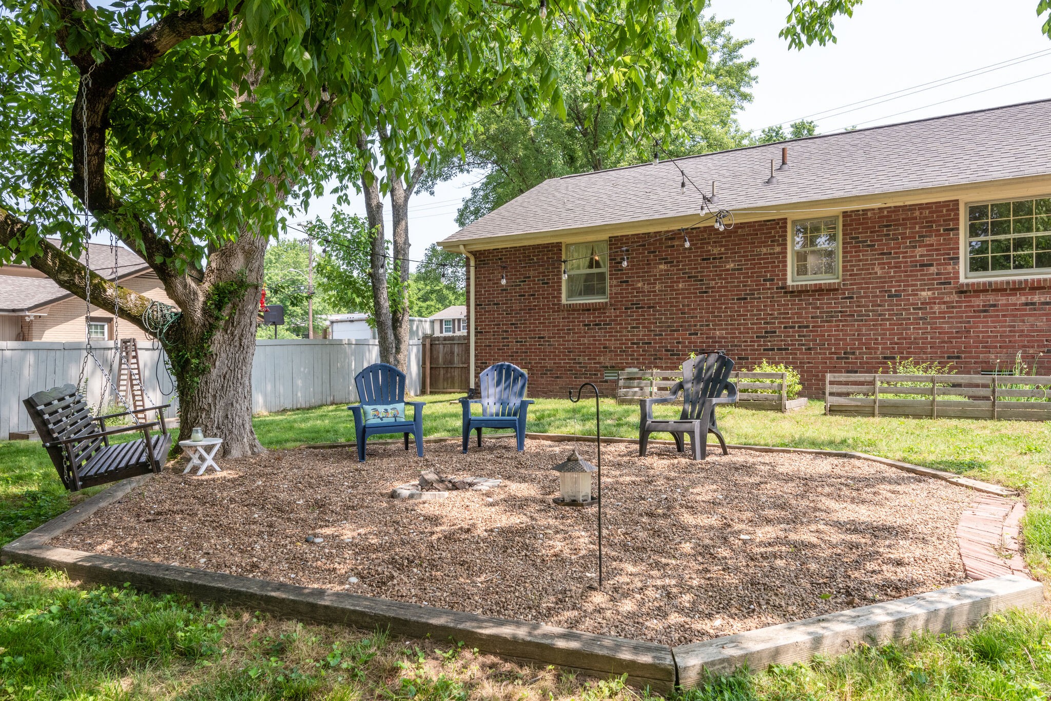 249 Bart Drive Antioch, TN 37013 - Photo 27 of 28 a backyard of a house with table and chairs