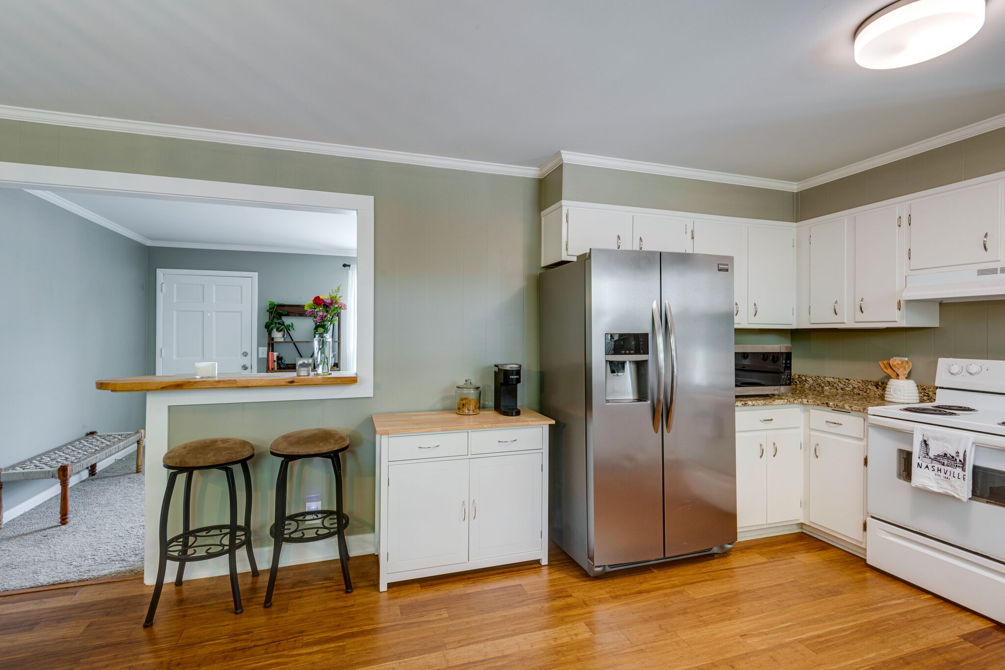 249 Bart Drive Antioch, TN 37013 - Photo 10 of 28 a kitchen with stainless steel appliances granite countertop a refrigerator and a stove top oven