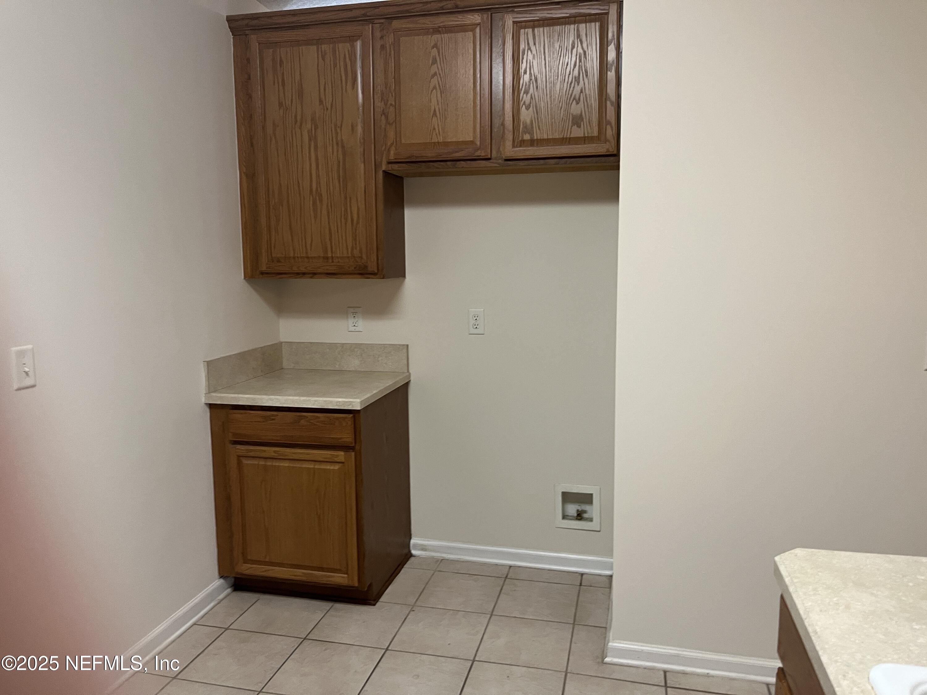 3898 Green View Terrace Middleburg, FL 32068 - Photo 12 of 43 a kitchen with granite countertop white cabinets and stainless steel appliances