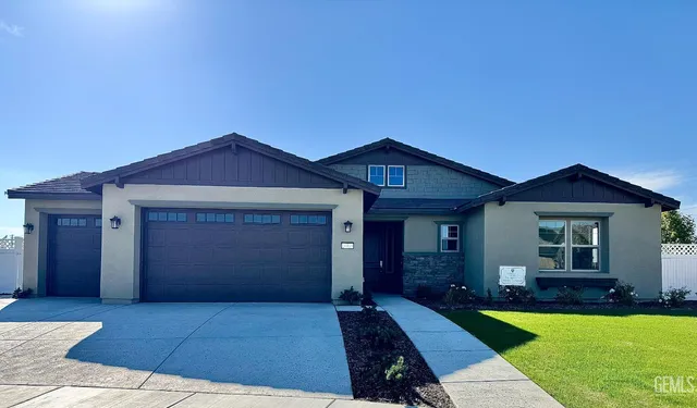 a front view of a house with yard