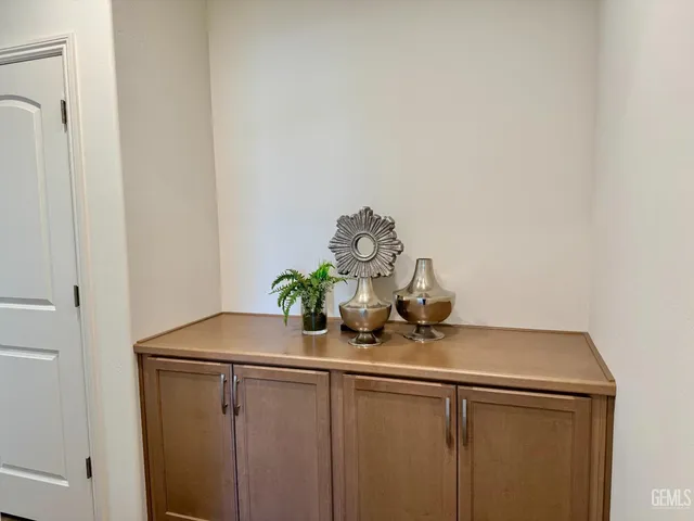 a view of a microwave and cabinets