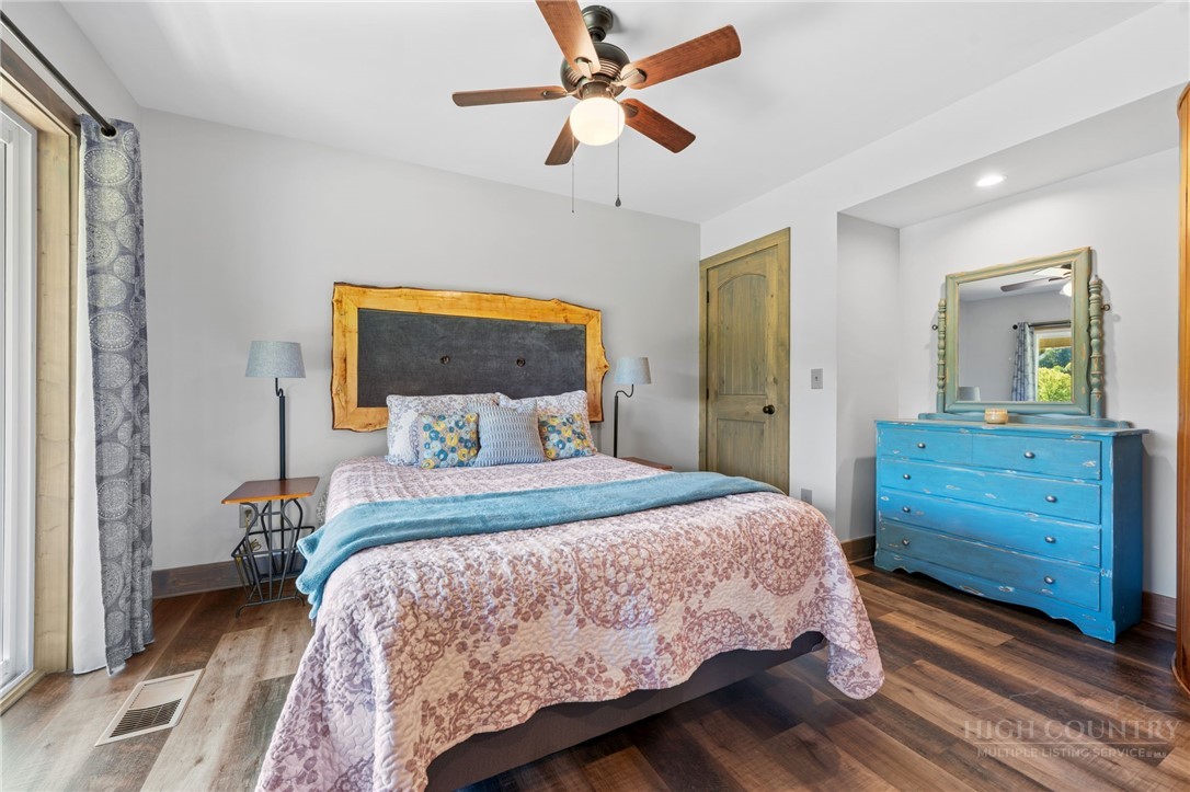 634-636 Watauga River Road Sugar Grove, NC 28679 - Photo 15 of 50 a bedroom with a bed and a dresser